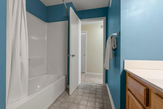 bathroom featuring vanity, baseboards, and shower / tub combo with curtain