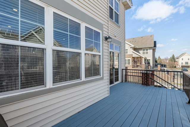 wooden terrace with a residential view