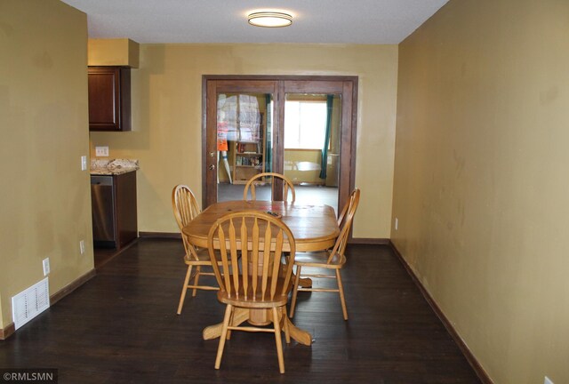 dining room featuring dark hardwood / wood-style flooring