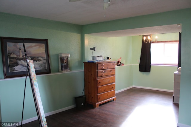 bedroom with ceiling fan and dark wood-type flooring