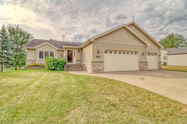 ranch-style home with a garage and a front lawn