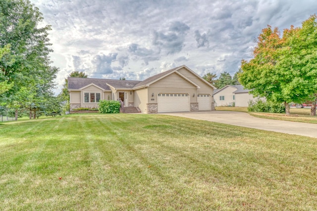 view of front of property with a front yard and a garage