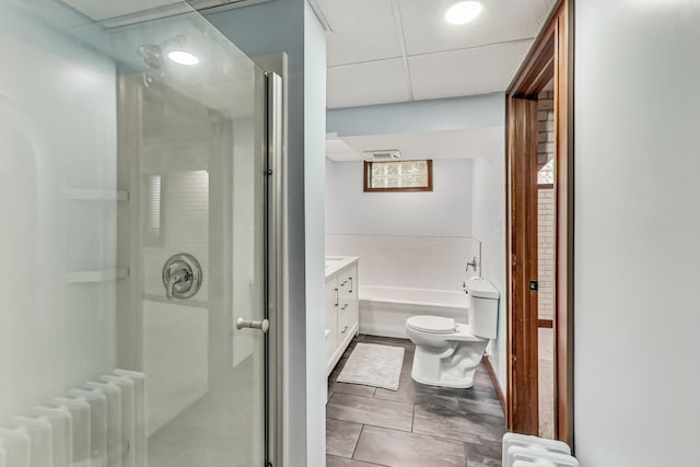 full bathroom featuring independent shower and bath, radiator, vanity, and toilet