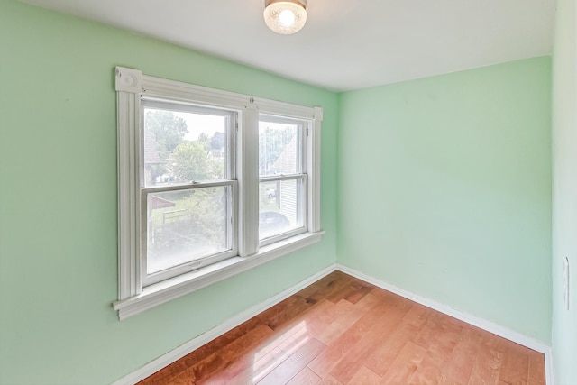 spare room with light hardwood / wood-style flooring