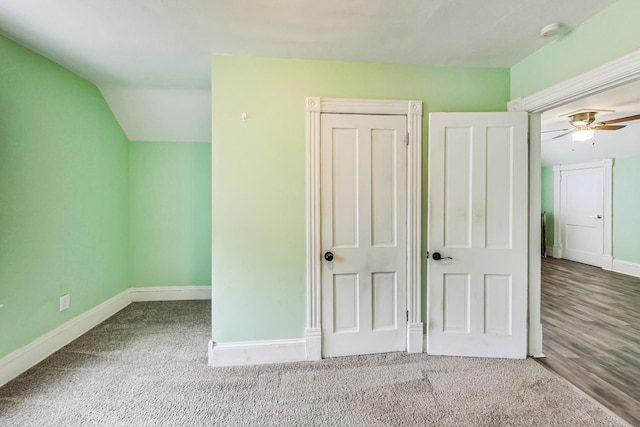 unfurnished bedroom with wood-type flooring, vaulted ceiling, and ceiling fan