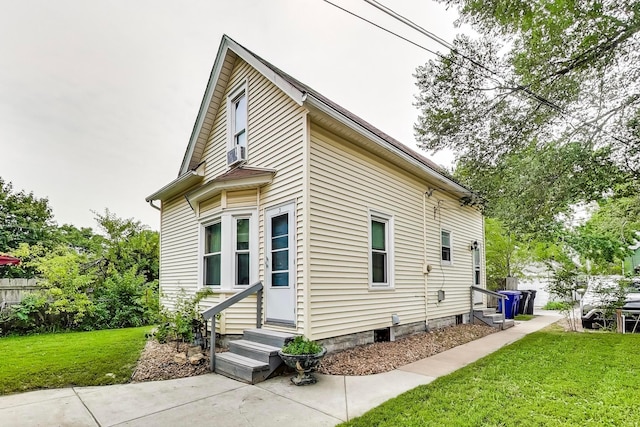 view of home's exterior with a yard