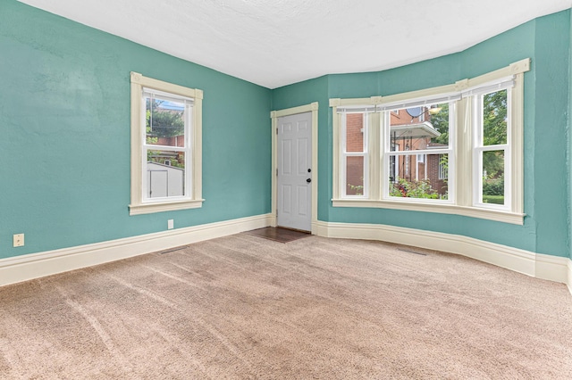 unfurnished room with carpet