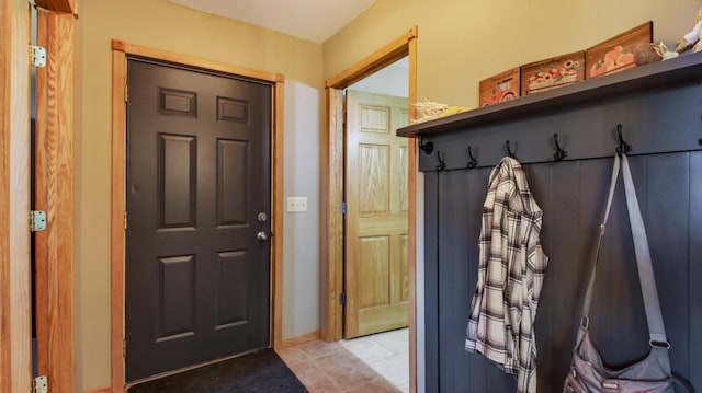 mudroom with light tile patterned flooring