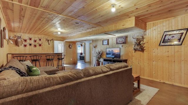 living room with wooden ceiling and wooden walls