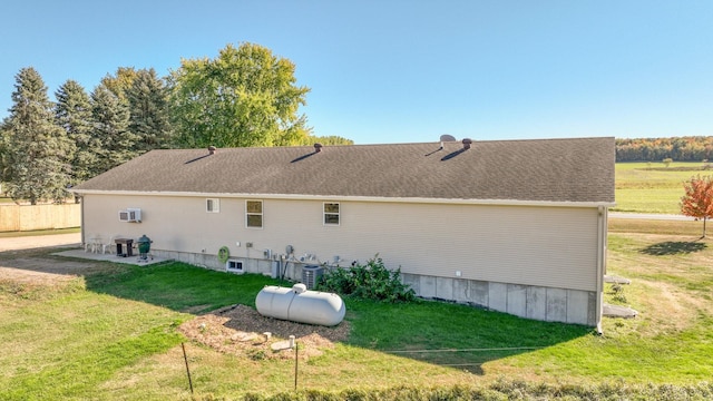 rear view of property with a lawn