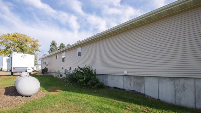 view of property exterior with a lawn