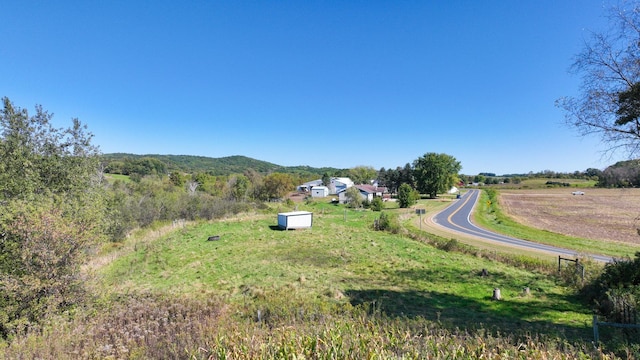 exterior space featuring a rural view and a mountain view