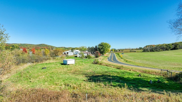 exterior space featuring a rural view and a mountain view