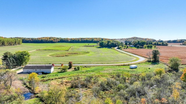 birds eye view of property with a rural view