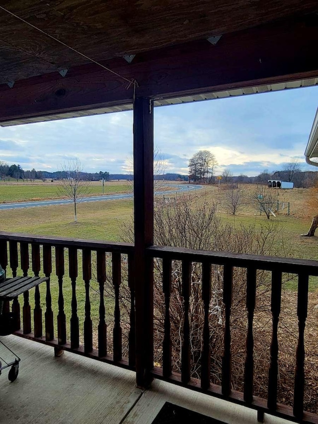 balcony featuring a rural view