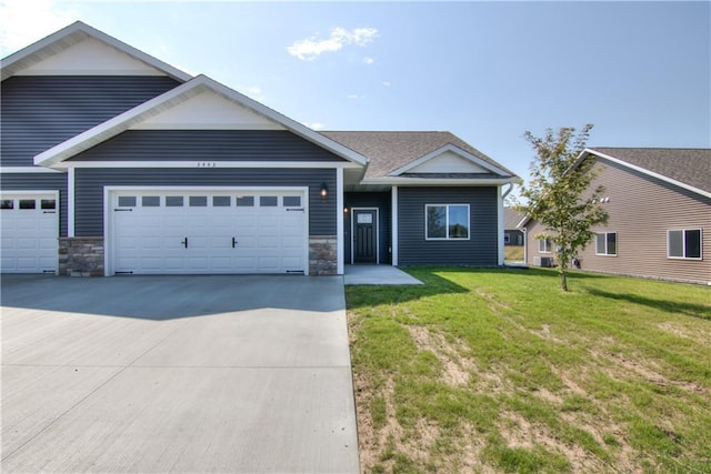 view of front of house featuring a garage and a front yard