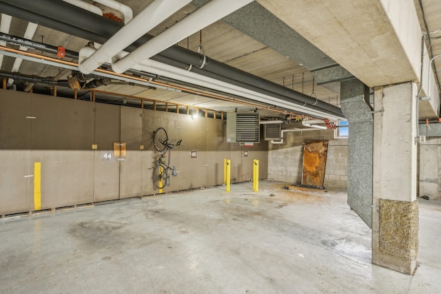 parking deck featuring concrete block wall