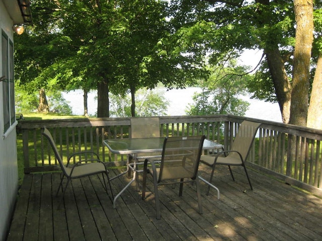 wooden deck featuring outdoor dining area