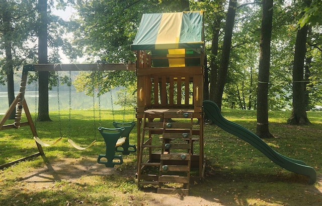 view of jungle gym featuring a lawn