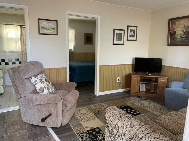 living room featuring wooden walls