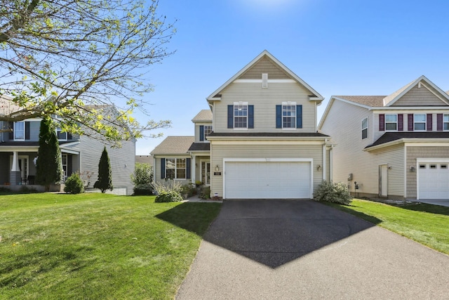 view of front of property featuring a garage and a front yard