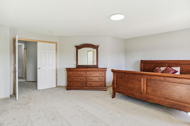 bedroom featuring light colored carpet