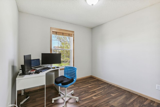 office space with dark hardwood / wood-style flooring and a textured ceiling