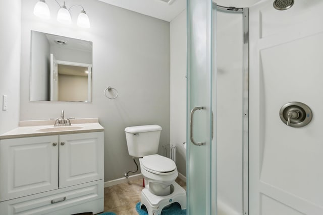 bathroom featuring vanity, an enclosed shower, and toilet