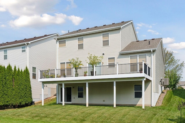 rear view of property with a lawn