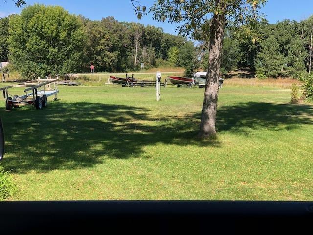 view of property's community with a lawn