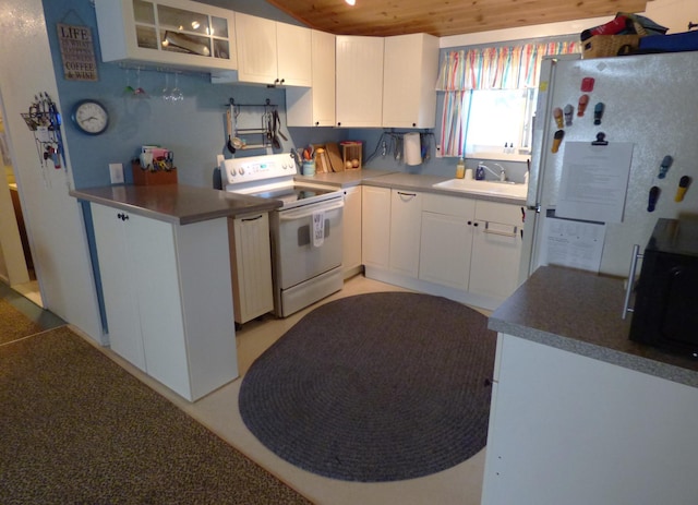 kitchen with wood ceiling, white appliances, sink, and white cabinets