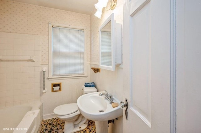 full bathroom with toilet, shower with separate bathtub, sink, and tile patterned flooring