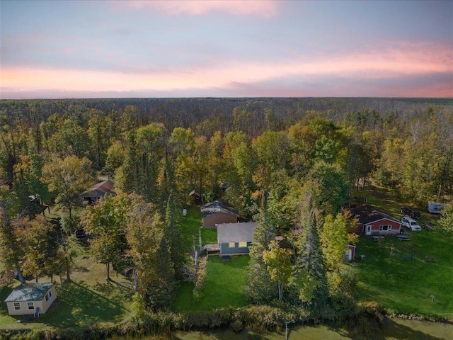 aerial view featuring a wooded view