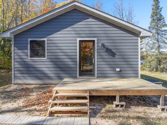 rear view of property featuring a deck