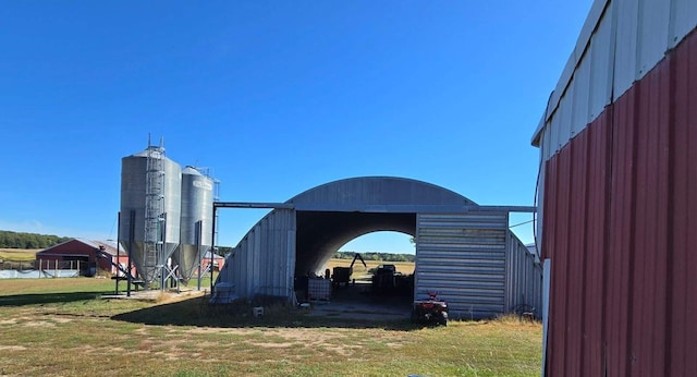 view of outdoor structure featuring a lawn