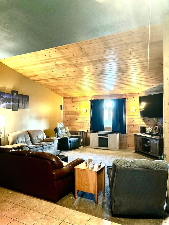 living room featuring lofted ceiling, wood walls, light tile patterned floors, and wooden ceiling