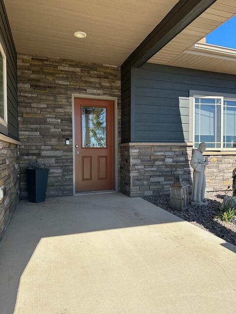 property entrance with a patio area