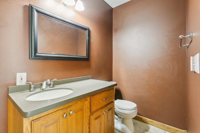 bathroom featuring vanity, toilet, and tile patterned floors