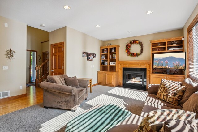 living room with light hardwood / wood-style flooring and a wealth of natural light