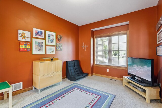 sitting room with carpet flooring