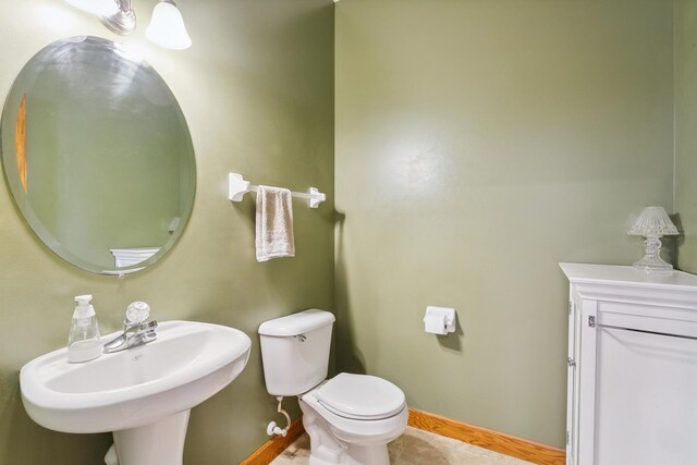 bathroom featuring sink and toilet