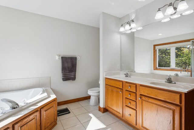 bathroom featuring vanity, a bathtub, toilet, and tile patterned floors