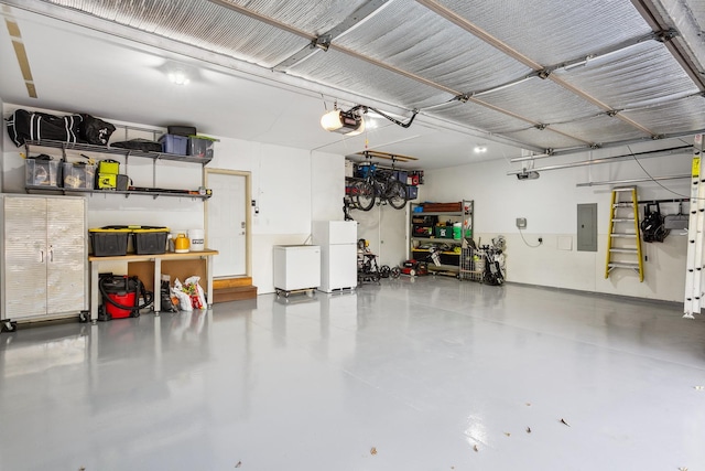 garage featuring a garage door opener, electric panel, and white fridge