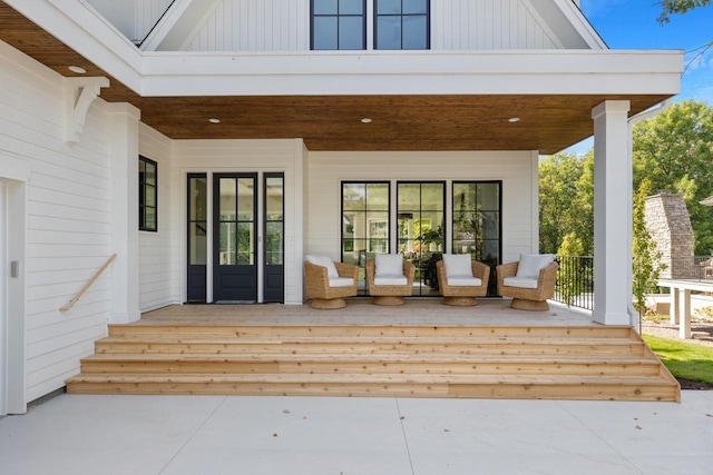 doorway to property with covered porch