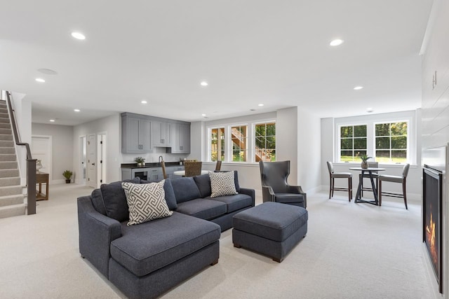 living room featuring light carpet