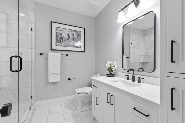 bathroom featuring vanity, toilet, and an enclosed shower