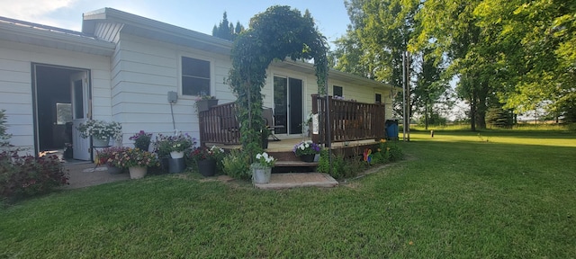 rear view of property with a lawn