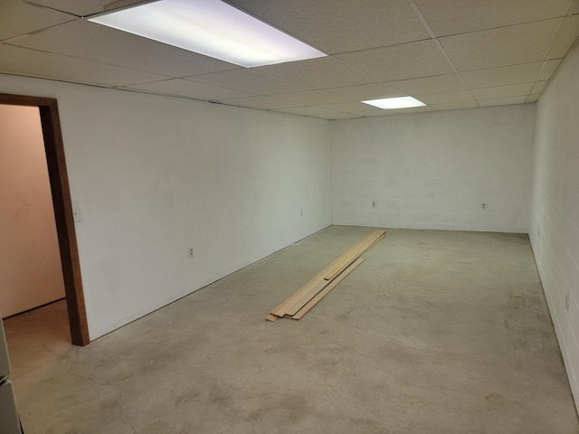 basement featuring a paneled ceiling