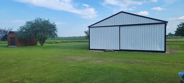 view of outdoor structure featuring a yard