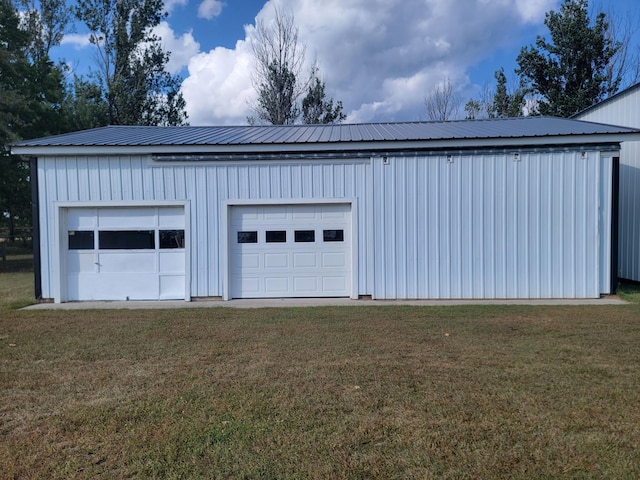 garage with a yard